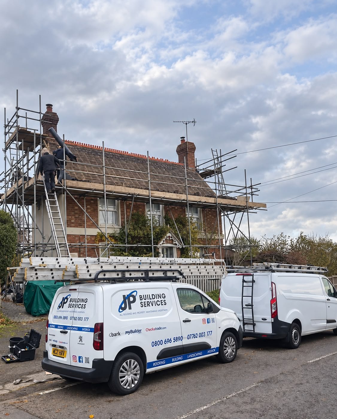 A re-roofing project with the J P Building Services van and team on site