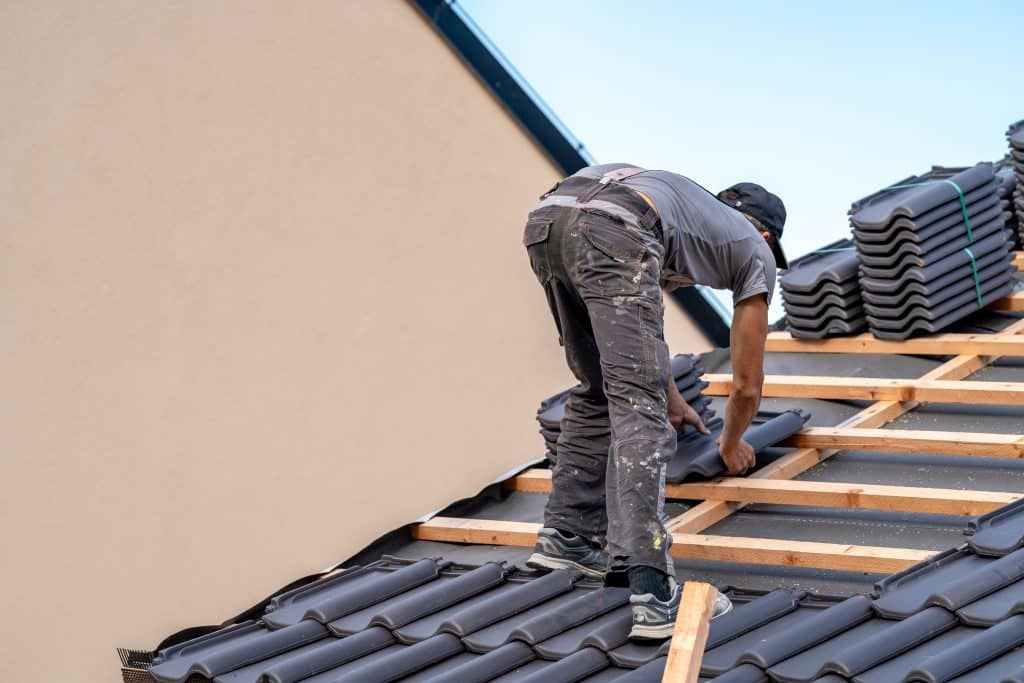 man fixing a roof